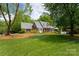 Beautiful brick home with a lush green lawn and mature trees at 2382 Erika Ln, Gastonia, NC 28056