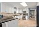 Bright kitchen showcases white cabinets, stainless steel appliances, and beautiful backsplash at 2382 Erika Ln, Gastonia, NC 28056