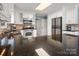 Bright kitchen featuring white cabinets, stone countertops, and modern stainless steel appliances at 2382 Erika Ln, Gastonia, NC 28056