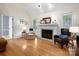 Inviting living room features a fireplace, hardwood floors, and comfortable seating, offering a cozy ambiance at 2382 Erika Ln, Gastonia, NC 28056