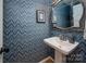 Stylish powder room with unique wallpaper, a pedestal sink, and a decorative mirror at 2382 Erika Ln, Gastonia, NC 28056
