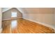 Finished attic space with hardwood floors, offering potential as an extra room at 2400 Commonwealth Ave, Charlotte, NC 28205