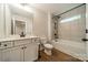 Beautiful bathroom with modern vanity, shower and tub combination, and neutral tile accents at 2400 Commonwealth Ave, Charlotte, NC 28205