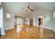 Bright bedroom with hardwood floors, neutral walls, and a walk-in bathroom at 2400 Commonwealth Ave, Charlotte, NC 28205