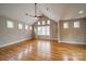 Bright bedroom with hardwood floors, neutral walls, and a large window at 2400 Commonwealth Ave, Charlotte, NC 28205