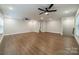 Spacious bonus room featuring hardwood floors, recessed lighting, neutral walls, and ceiling fans at 2400 Commonwealth Ave, Charlotte, NC 28205