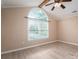 Spacious bedroom featuring a large window and vaulted ceiling with a wood beam at 2439 Caswell Ct, Gastonia, NC 28054