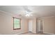 Relaxing bedroom with modern flooring, a window for natural light and an entry door at 2439 Caswell Ct, Gastonia, NC 28054