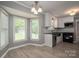 Inviting dining area with large windows and modern lighting near the kitchen at 2439 Caswell Ct, Gastonia, NC 28054