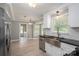 Bright kitchen featuring stainless steel appliances, granite countertops, and a farmhouse sink at 2439 Caswell Ct, Gastonia, NC 28054