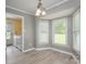 Bright laundry room features a modern washer and dryer setup near a large window at 2439 Caswell Ct, Gastonia, NC 28054