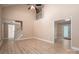 Spacious open-concept living room with light wood floors, high ceilings, and versatile layout at 2439 Caswell Ct, Gastonia, NC 28054