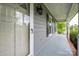 Inviting front porch with gray flooring and white railing with view of the neighborhood at 2439 Caswell Ct, Gastonia, NC 28054