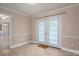Bright room with modern trim and light wood floors, perfect for dining or a home office at 2439 Caswell Ct, Gastonia, NC 28054