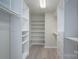 Well-organized walk-in closet with ample shelving and drawer space at 2439 Caswell Ct, Gastonia, NC 28054