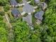 An aerial view of a home and neighborhood with mature trees and a pool at 246 Mcduffie Ln, Fort Mill, SC 29715