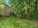 Large yard with a deck, trees, and a peek at the hot tub at 246 Mcduffie Ln, Fort Mill, SC 29715