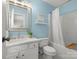 Bright bathroom featuring light blue walls, white vanity, and shower and tub combo at 246 Mcduffie Ln, Fort Mill, SC 29715