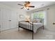 Cozy bedroom featuring a ceiling fan, white trim, a large closet and natural light at 246 Mcduffie Ln, Fort Mill, SC 29715