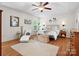 Inviting primary bedroom features light walls, wood floors, and lots of natural light at 246 Mcduffie Ln, Fort Mill, SC 29715