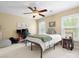 Comfortable bedroom featuring a ceiling fan, a gaming setup, and natural light at 246 Mcduffie Ln, Fort Mill, SC 29715