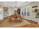 Charming dining area with wainscoting, large windows and hardwood flooring at 246 Mcduffie Ln, Fort Mill, SC 29715