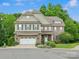 Two-story brick home with well-maintained landscaping and a two-car garage at 246 Mcduffie Ln, Fort Mill, SC 29715
