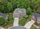 An aerial view of a beautiful home with manicured lawns and a driveway at 246 Mcduffie Ln, Fort Mill, SC 29715