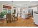 Open kitchen and dining area featuring stainless steel appliances and wooden dining set at 246 Mcduffie Ln, Fort Mill, SC 29715
