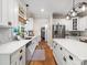 Spacious kitchen features stainless steel appliances, white cabinetry, and a view into pantry at 246 Mcduffie Ln, Fort Mill, SC 29715