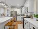 Bright kitchen with stainless appliances, white cabinets and island with counter seating at 246 Mcduffie Ln, Fort Mill, SC 29715
