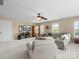 Spacious living room with neutral walls, carpet, ceiling fan, and lots of natural light at 246 Mcduffie Ln, Fort Mill, SC 29715