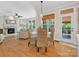 Living room and dining area with fireplace and views of the outdoor living at 246 Mcduffie Ln, Fort Mill, SC 29715