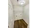 Functional laundry room with shelving and utility connections for washer and dryer at 2512 Captains Watch Ne Rd, Kannapolis, NC 28083
