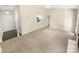 Bright living room featuring neutral paint, plush carpet, and a view into the kitchen at 2512 Captains Watch Ne Rd, Kannapolis, NC 28083