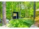 Backyard view of a home batting cage, set up with an artificial turf floor and a net surround at 288 Ridge Reserve Dr, Lake Wylie, SC 29710