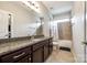 Granite topped vanity in bathroom with tile flooring and bath/shower at 288 Ridge Reserve Dr, Lake Wylie, SC 29710