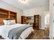 Bedroom with built-in bookshelves and desk area, hardwood floors, and a comfortable bed at 288 Ridge Reserve Dr, Lake Wylie, SC 29710