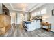 Bright, spacious bedroom with chandelier, natural light, and wood floors at 288 Ridge Reserve Dr, Lake Wylie, SC 29710