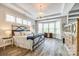 Spacious bedroom with tray ceiling, natural light, and wood floors at 288 Ridge Reserve Dr, Lake Wylie, SC 29710