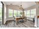 Dining area with natural light, wood table, seating for six, and wood floors at 288 Ridge Reserve Dr, Lake Wylie, SC 29710