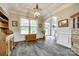 Formal dining room featuring wainscoting, hardwood floors, and elegant lighting fixtures, great for gatherings at 288 Ridge Reserve Dr, Lake Wylie, SC 29710