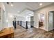 Bright upstairs hallway featuring wood floors, iron railing, and an open view of the ceiling design at 288 Ridge Reserve Dr, Lake Wylie, SC 29710