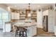 Modern kitchen with a large island, stainless steel appliances, and stylish backsplash, perfect for cooking at 288 Ridge Reserve Dr, Lake Wylie, SC 29710