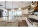 Bright, modern kitchen featuring an island, stainless steel appliances, and wood floors at 288 Ridge Reserve Dr, Lake Wylie, SC 29710