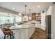 Bright kitchen with granite countertops, stainless steel appliances, and eat-in dining area at 288 Ridge Reserve Dr, Lake Wylie, SC 29710