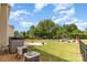 Backyard featuring large lawn, manicured garden, and mature trees at 3005 Sandbox Cir, Indian Trail, NC 28079