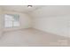 Upstairs bedroom features carpet, light walls and trim, and bright, natural light at 3005 Sandbox Cir, Indian Trail, NC 28079