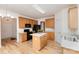Charming kitchen with wood cabinets, a center island, and modern black appliances at 3005 Sandbox Cir, Indian Trail, NC 28079