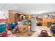 Unfinished basement with wood paneling, storage, and various tools and equipment throughout the cluttered space at 3265 W Innes St, Salisbury, NC 28144